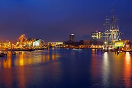 Port of Amsterdam by night with the VOC ship in the Netherlands by Eye on You