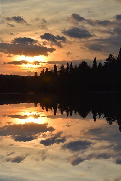 A sunset over the lake in autumn by Claude Laprise