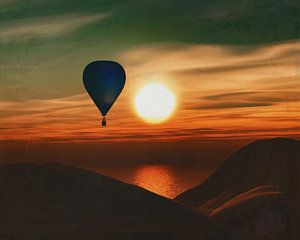 hot air balloon sail over the sea in the sunset