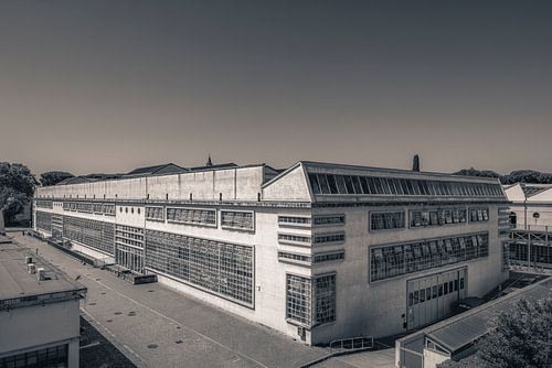 A modern industrial building in black and white
