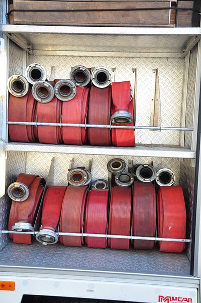 brandslangen in brandweer auto by Marten Wieringa