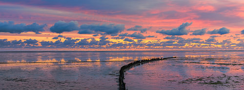 Panorama and sunrise over the Wadden Sea by Henk Meijer Photography