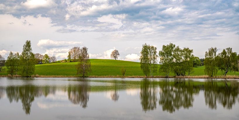 Reflections on a lake by Holger W. Spieker