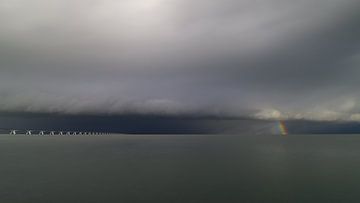 The Zeeland Bridge and a winter shower with rainbow