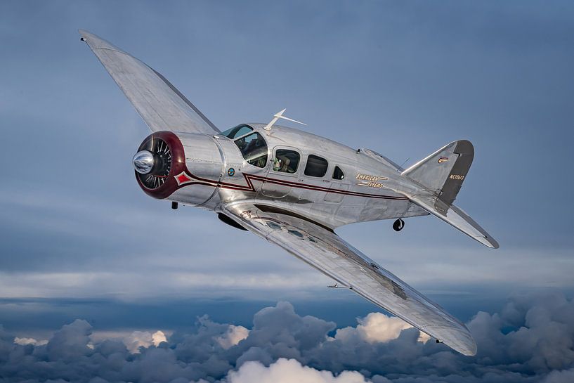 Classic airplane above the clouds by Planeblogger