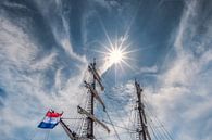 Tweemaster and the sun in the harbour of Lemmer, Friesland. by Harrie Muis thumbnail