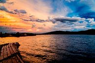 Sunset over the Uros islands on Lake Titicaca in Peru by John Ozguc thumbnail