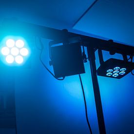Color tuned led spotlights on a truss in front of a dark blue ba by Maren Winter