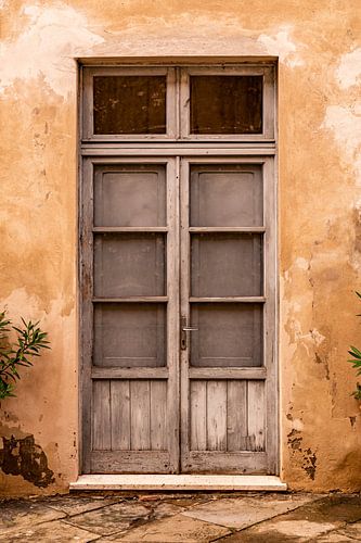 Mediterranean flaking wooden door
