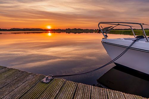 Moored boat during sunrise