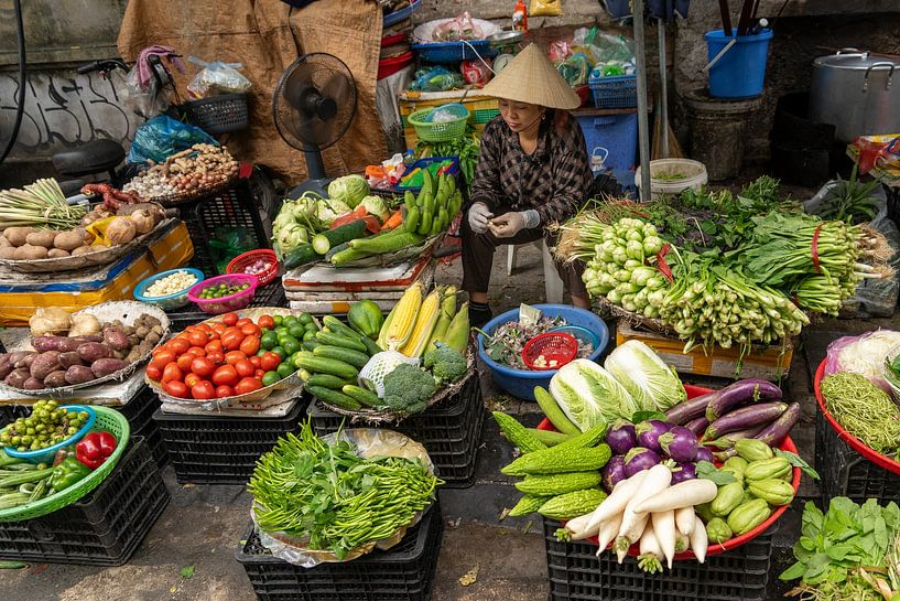 Fresh vegetables for sale on the streets of Hanoi by Ron Poot