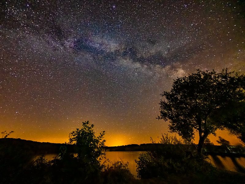 the Milky Way over a mountain lake by Ton Valk