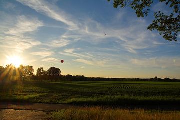 a balloon ride with sunset in august by tiny brok