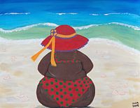 Dikke dame aan het strand