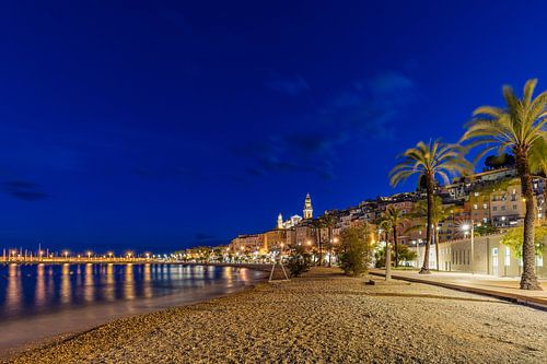 Menton beach and old town by night - France by Werner Dieterich