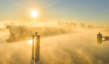 Fog above the Van Starkenborg Canal in Groningen on a beautiful spring morning in May by Bas Meelker