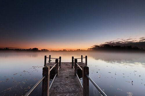 Foggy lake Vriescheveen at dawn