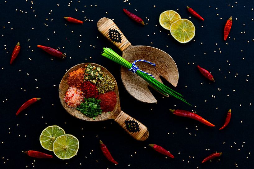 Spices and herbs on wooden spoons by Francis Dost