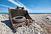 bucket of an excavator on the beach