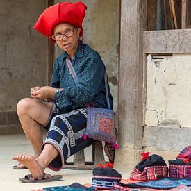 Red Dao woman at work by Richard van der Woude