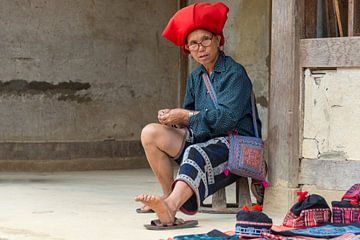 Red Dao woman at work by Richard van der Woude