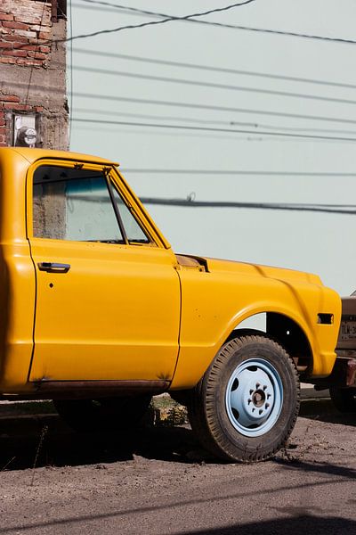 Yellow car | tough | industrial wall art | car art print | Oaxaca | Mexico by Kimberley Helmendag