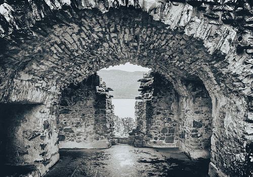 Inside Urquhart Castle in Scotland. Catacombs ruin by the defensive wall.