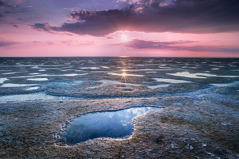 Sunset over mudflats of Wadden Sea by Fotografiecor .nl