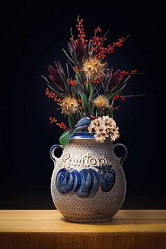 Red berries in vase by Klaartje Majoor