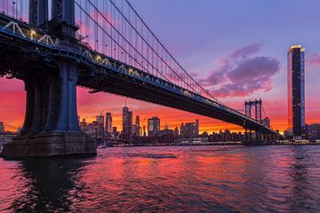 Skyline of Manhattan and Manhattan Bridge at sunset, New York, USA by Markus Lange