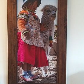 Customer photo: Bolivia, little girl with Alpaca by Tanja de Mooij