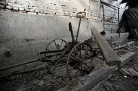 A farm tool in a barn.