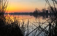 eerste zon boven het meer