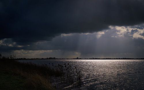Dark clouds over the water