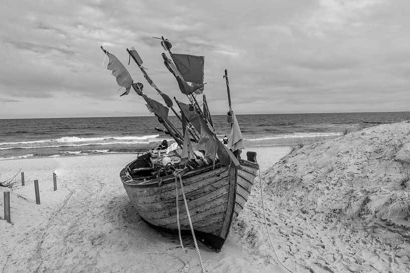 Black and white photography fishing boat at the Baltic Sea on the beach by Animaflora PicsStock