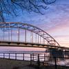 De Wilhelminabrug met bewolking in de winter in Deventer Overijssel van Bart Ros