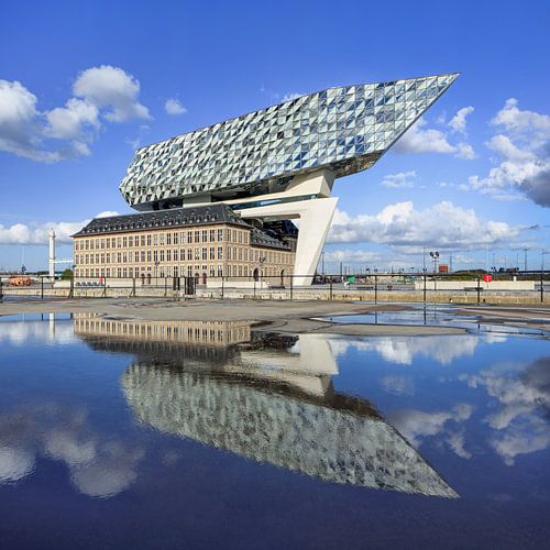 Antwerp Port House on sunny day blue sky reflected in a pond 1