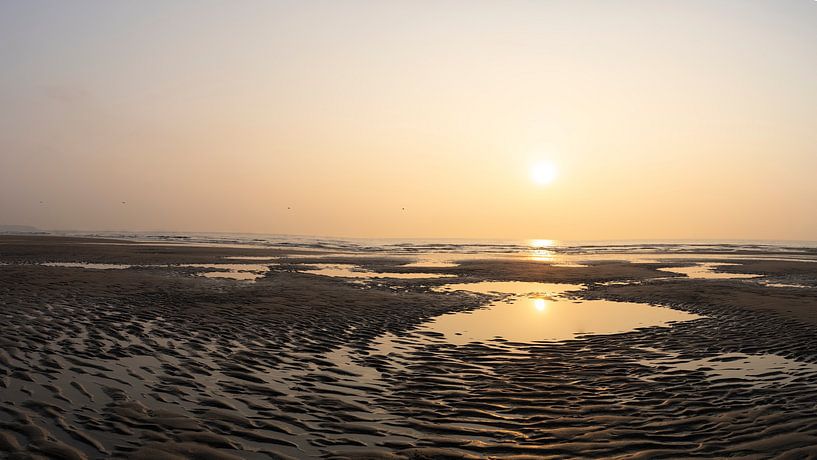 Beach at Opal Coast with setting sun by Leoniek van der Vliet