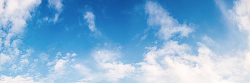 Clouds on a blue sky as background by Günter Albers