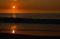 zonsondergang strand