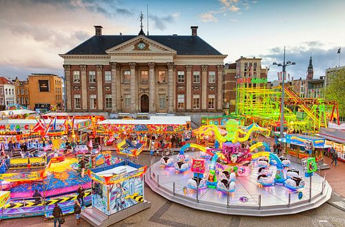 Annual May Fair at the Market Square in the city of Groningen with the city hall in the background