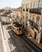 Tram in narrow street in Lisbon