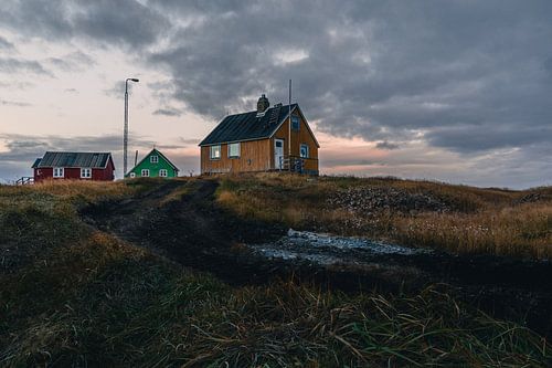 Remote Greenland village against the setting sun