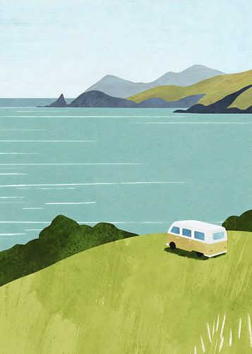 Vintage camper van parked on a green hill overlooking the ocean