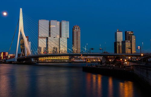 skyline of rotterdam at sunset with moon by Ilya Korzelius