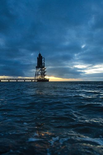 Lighthouse on the North Sea at sunset