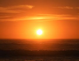 Rising sun in Moeraki, New Zealand by J V