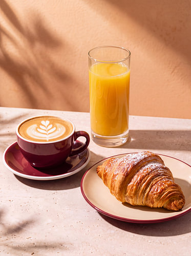 Cappuccino, croissant and orange juice