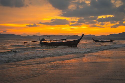 Beautiful sunset on the Aon Nang beach in Thailand.