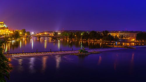 Night photo of Prague with view of the Danube and Legion Bridge